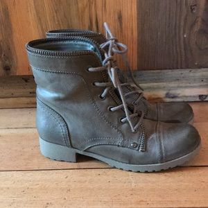 A unique style of boot, with vintage detail and gray leopard print inside.